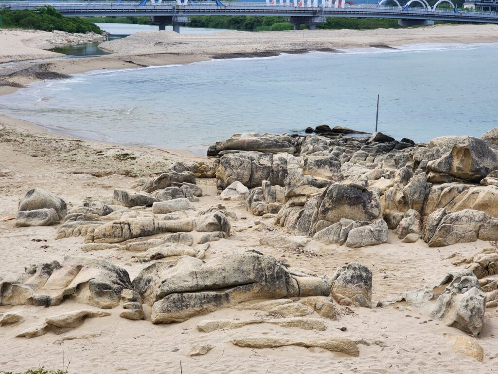 Quiet sandy beach and rocky shorelines along the East Sea in Goseong.