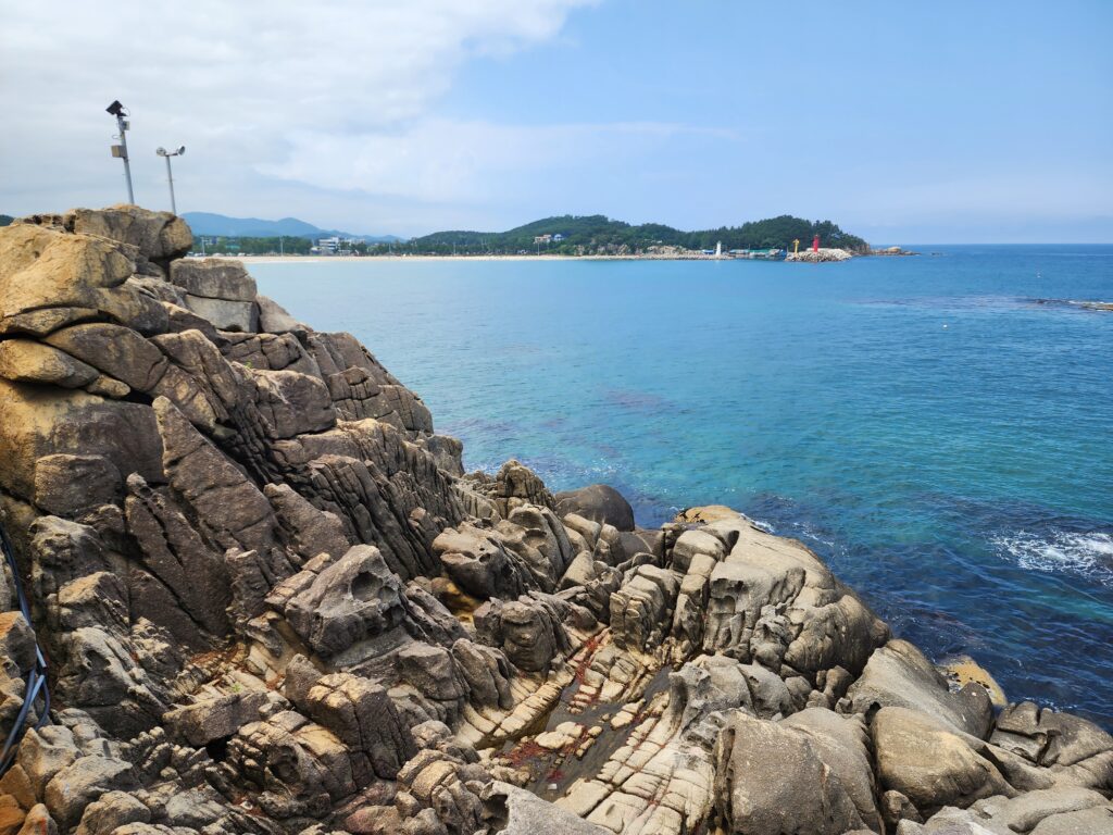 Panoramic views of the deep blue East Sea horizon from the rocks of Neungpadae.