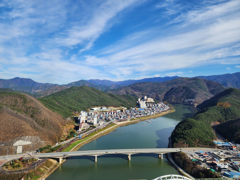 A stunning bird's-eye view of Danyang town and the winding river from the skywalk.